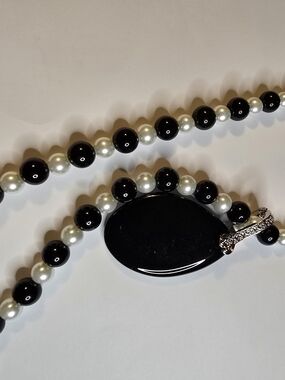 Black and White Beaded Necklace with Glossy Black Oval Pendant